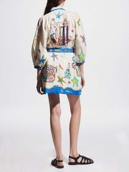 MINI VESTIDO CON ESTAMPADO TROPICAL Y CINTURÓN